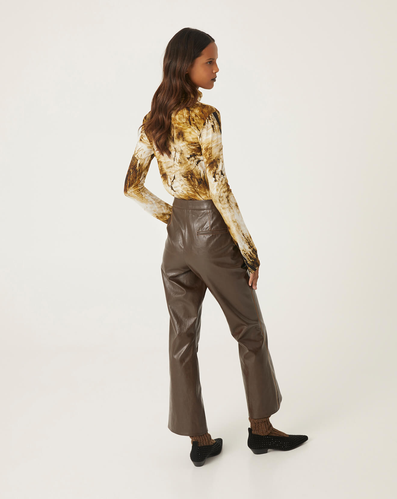 trumpet-shaped eco-leather trousers