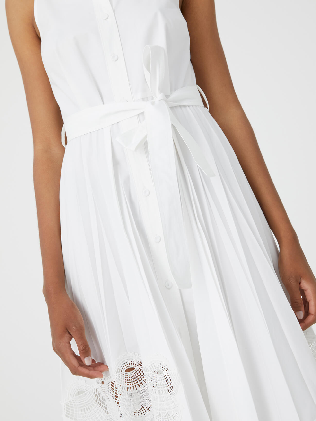 long pleated white dress with lace inserts