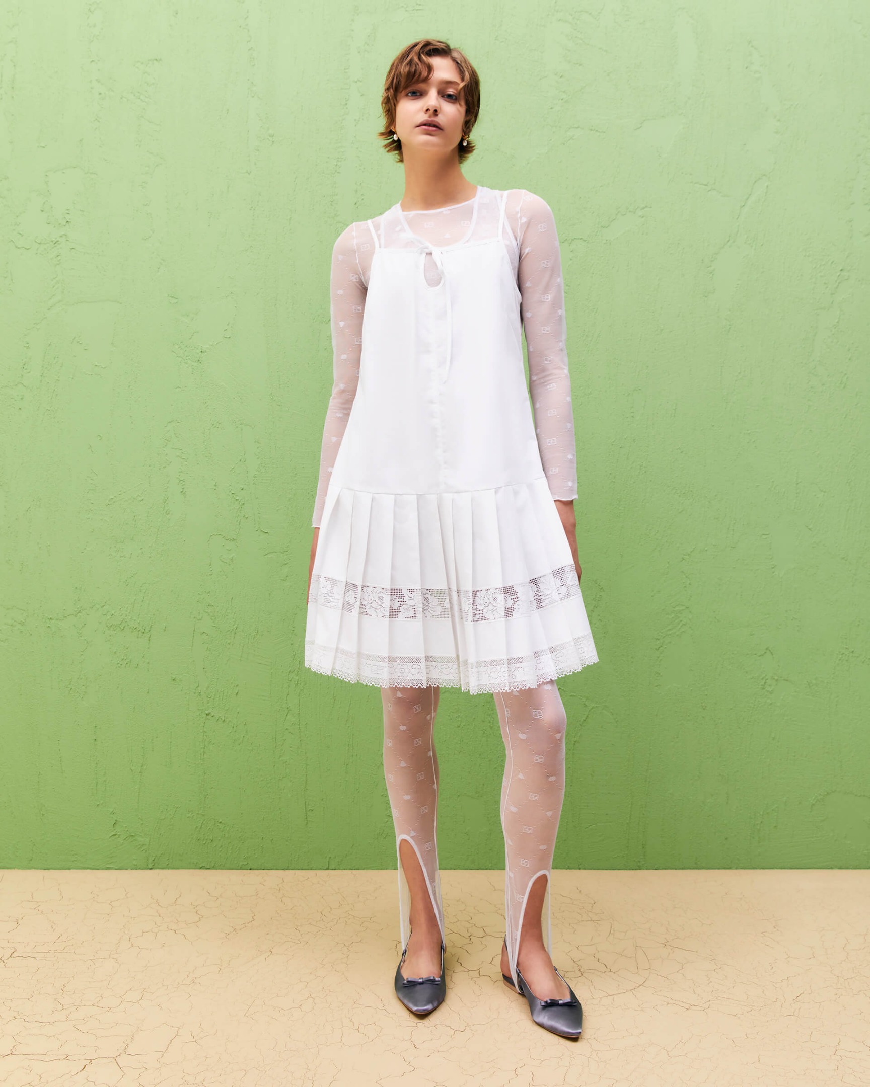 dress with pleated skirt and lace inserts